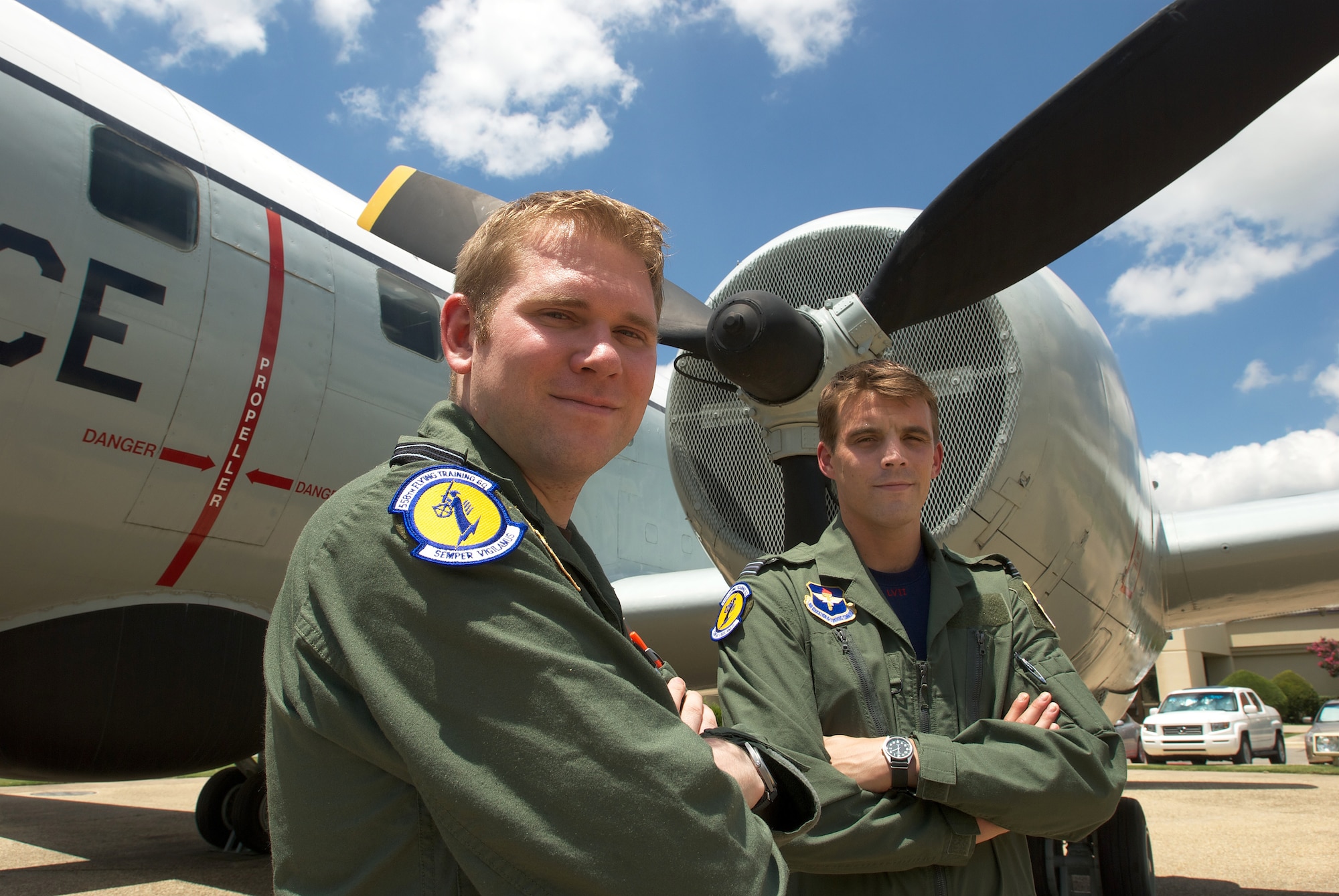 Royal air force Flight Lieutenants Tim Daunton and Dale Sharp stop for a photo a few days before graduating from a remotely piloted aircraft course, Randolph Air Force Base, Texas. The two lieutenants are part of an exchange and will go on to Creech AFB from Randolph. (U.S. Air Force Photo/Brian McGloin)