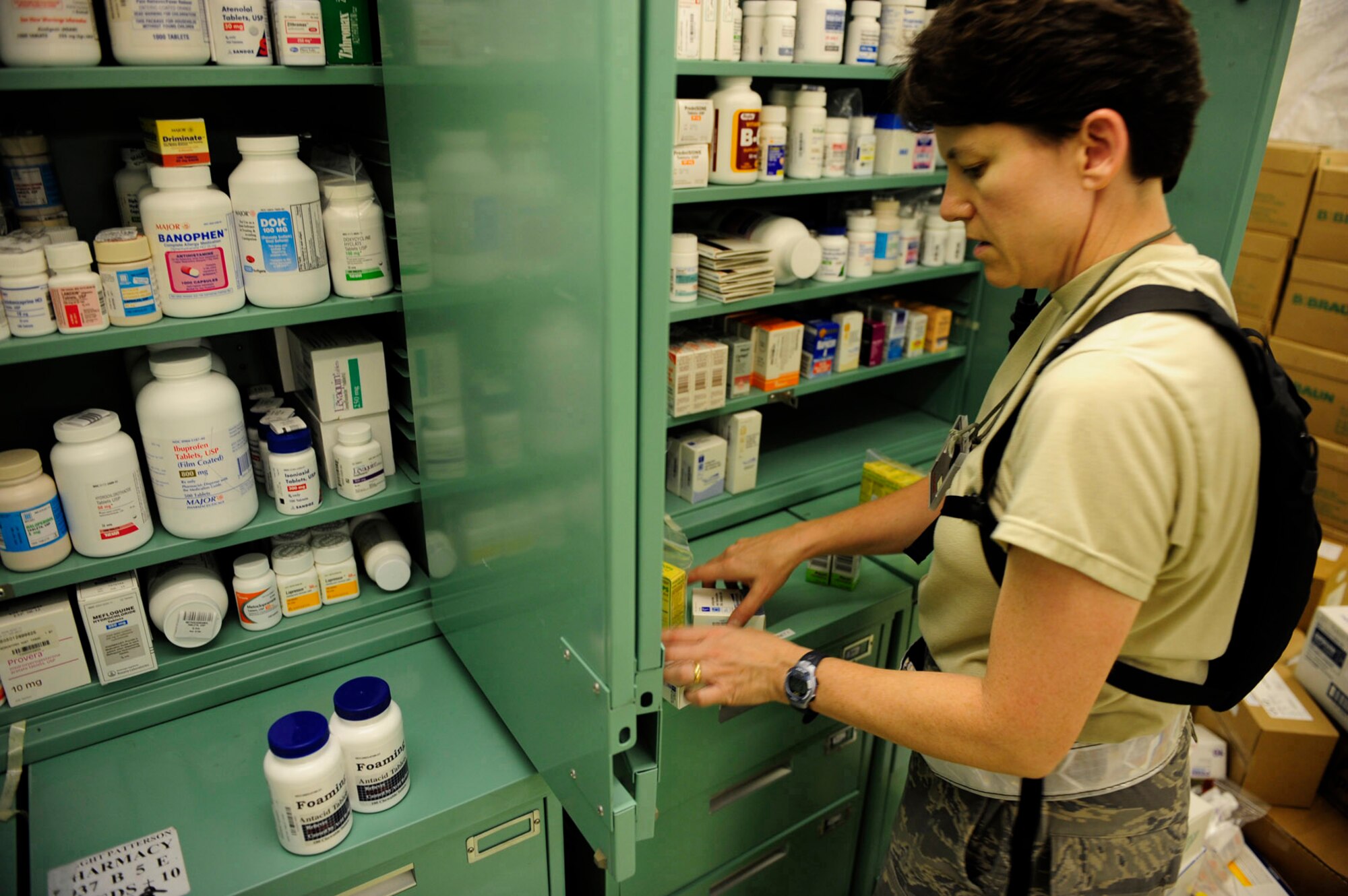 Maj. Vina Howarth, 59th Pharmacy Squadron, stores pharmaceutical supplies in the Expeditionary Medical Support tent during exercise Vibrant Response July 14, 2010, at Camp Atterbury, Ind. The Vibrant Response 10.2 field training exercise was a U.S. Army North training event for the chemical, biological, radiological, nuclear, high yield explosives consequence management response force 10.2. (U.S. Air Force photo/Airman 1st Class Samuel W. Goodman)