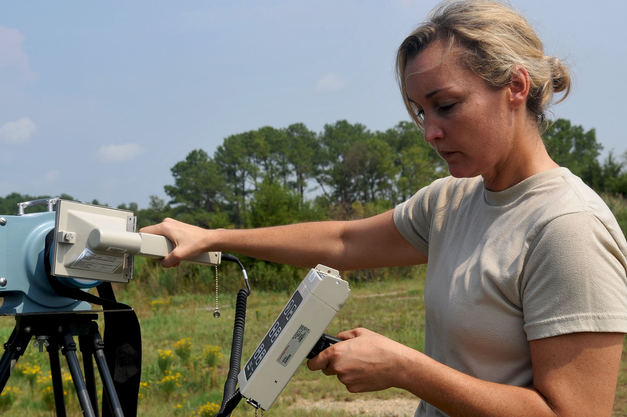LANGLEY AIR FORCE BASE, Va. -- Capt. Tiffany Kennedy, 633d Medical Group Bio-environmental engineer, scans for airborne alpha particles during the Major Accident Response Exercise Aug. 12. The MARE tested the preparedness of first responders and base personnel. (U.S. Air Force photo/Staff Sgt. Ashley Hawkins)