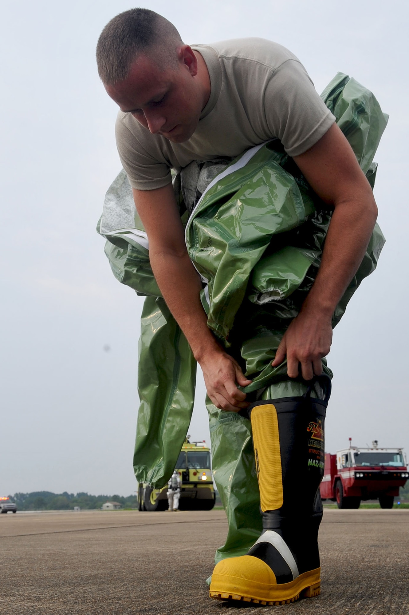 LANGLEY AIR FORCE BASE, Va. -- Staff Sgt. Robert Myers, 1st Component Maintenance Squadron fuels technician, dons protective equipment during the Major Accident Response Exercise Aug. 12. The MARE scenario involved a C-17 crash with nuclear munitions on board and was designed to test the preparedness of first responders and base personnel. (U.S. Air Force photo/Staff Sgt. Ashley Hawkins)
