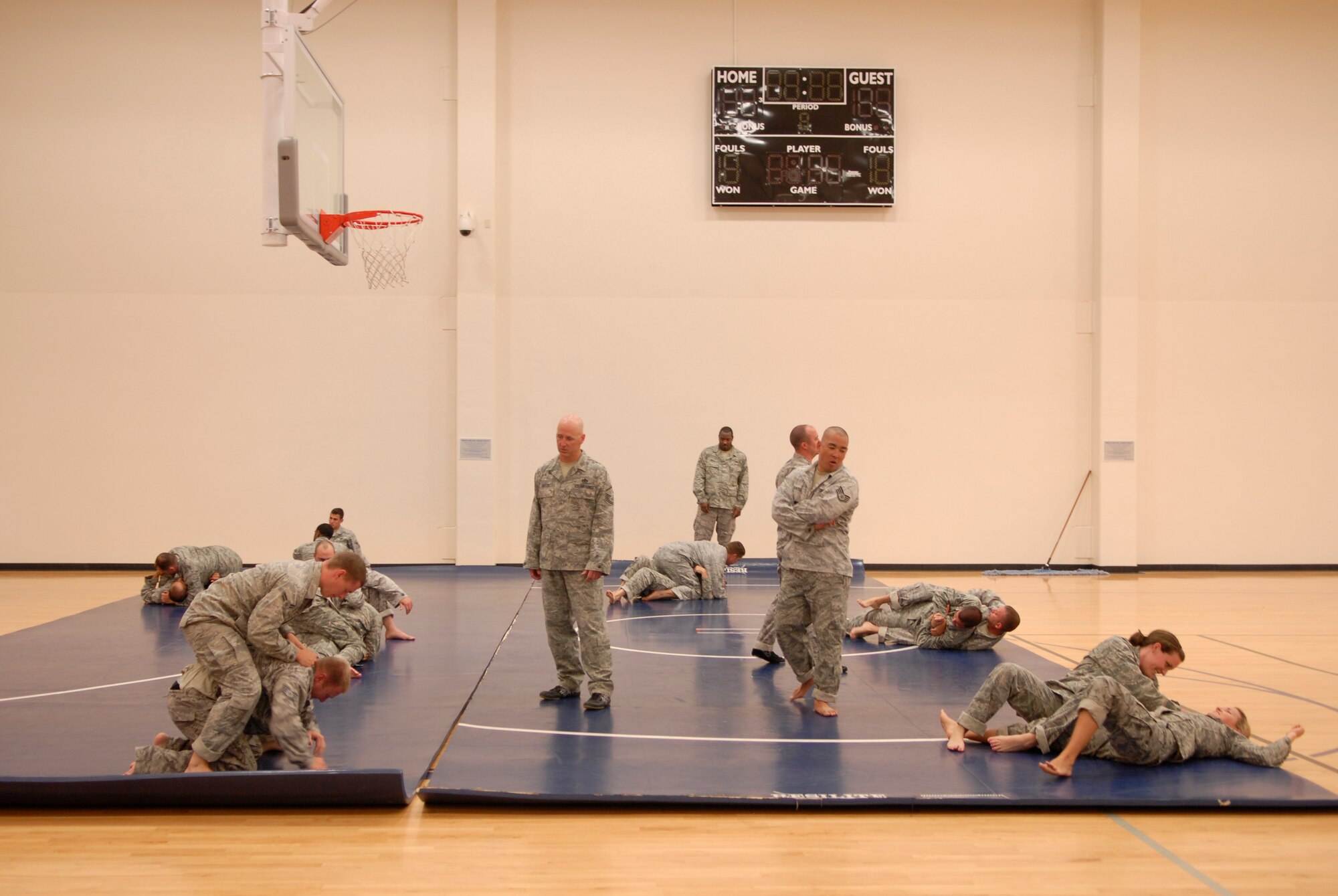 VANDENBERG AIR FORCE BASE, Calif. -- Airmen from the 30th Civil Engineer Squadron practice hand-to-hand combat during a combatives training course at the base fitness center here Tuesday, Aug. 10, 2010.  The instructors gave detailed instructions to ensure the safety of the trainees while teaching how to defend themselves in a combat environment.  (U.S. Air Force photo/Senior Airman Andrew Satran) 

 

 

 

 

 

 

 