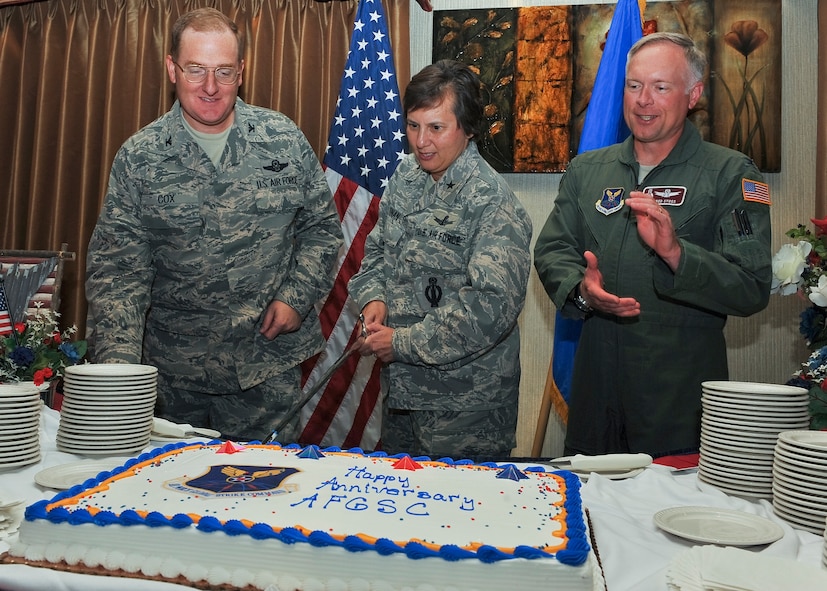 MINOT AIR FORCE BASE, N.D. -- Brig. Gen. Sandra Finan (center), Air Force Global Strike Command Inspector General, Col. Douglas Cox (left), 5th Bomb Wing commander, and Col. Fred Stoss (Right), 91st Missile Wing commander, participate in a cake-cutting ceremony at the Jimmy Doolittle Center here Aug. 12. The ceremony celebrated the first anniversary of Air Force Global Strike Command’s activation on Aug. 7, 2009. (U.S. Air Force photo by Senior Airman Michael J. Veloz)