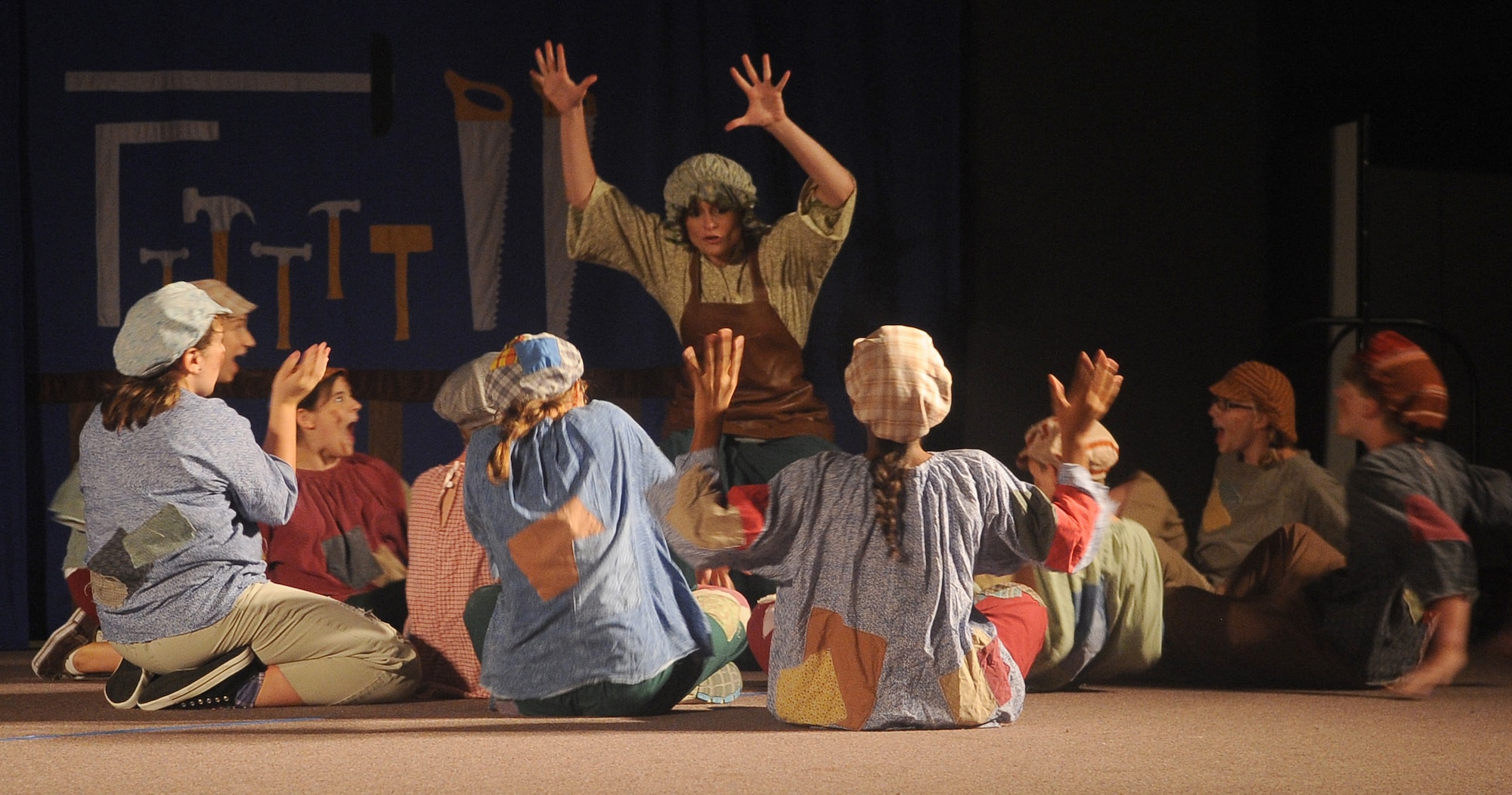 BARKSDALE AIR FORCE BASE, La. - Laura Cole, Missoula Theatre instructor acting as ?Mrs. Geppetto?, begins the story about a wooden puppet who becomes a boy during the Missoula Theatre production of ?Pinocchio? Aug. 6 at Hoban Hall. The Missoula Children?s Theatre is a company that travels throughout the United States and to 17 other countries, to help children from each community to put on a play in a week?s time. (U.S. Air Force photo/Senior Airman Amber Ashcraft) (RELEASED)