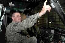 MINOT AIR FORCE BASE, N.D. -- Tech. Sgt. Christopher Haynes, 54th Helicopter Squadron noncommissioned officer-in-charge aircrew flight equipment, turns on the UH-1N helicopter’s radio system here Aug. 10. Ensuring the functionality of the radio system is one of many tasks performed by the aircrew flight equipment flight. (U.S. Air Force photo by Senior Airman Michael J. Veloz)