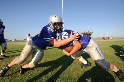 Ian Coleman, Ro-hawks varsity defensive tackle, and guard Cole Thompson work on their tackling and hitting techniques at full pad practice Aug. 11 in preparation for the 2010 football season. (U.S. Air Force photo/Steve Thurow)
