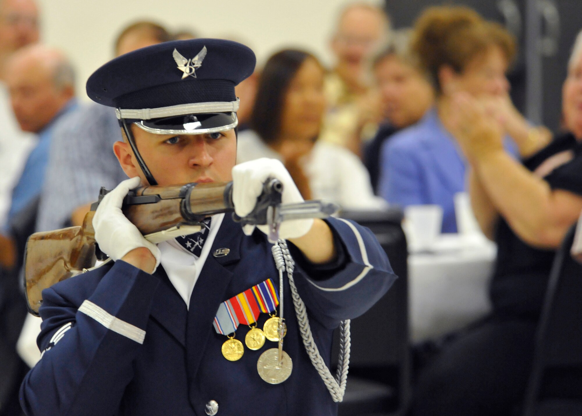 ALAMOGORDO, N.M. -- Senior Airman Aaron Fowler, a member of the U.S. Air Force Honor Guard Drill Team, holds an M-1 Garand rifle while performing a four-man demonstration for the Operation Wounded Warrior Dine and Dance held at the Elks lodge Aug. 7, 2010. Sixteen members from the AF Honor Guard also performed for the base populous at Holloman Air Force Base a day earlier. The AF Honor Guard Drill Team is the traveling component of the USAF Honor Guard and inspires Air Force awareness among military and civilian audiences through its complex drill routine. (U.S. Air Force photo by Senior Airman Veronica Stamps / Released)