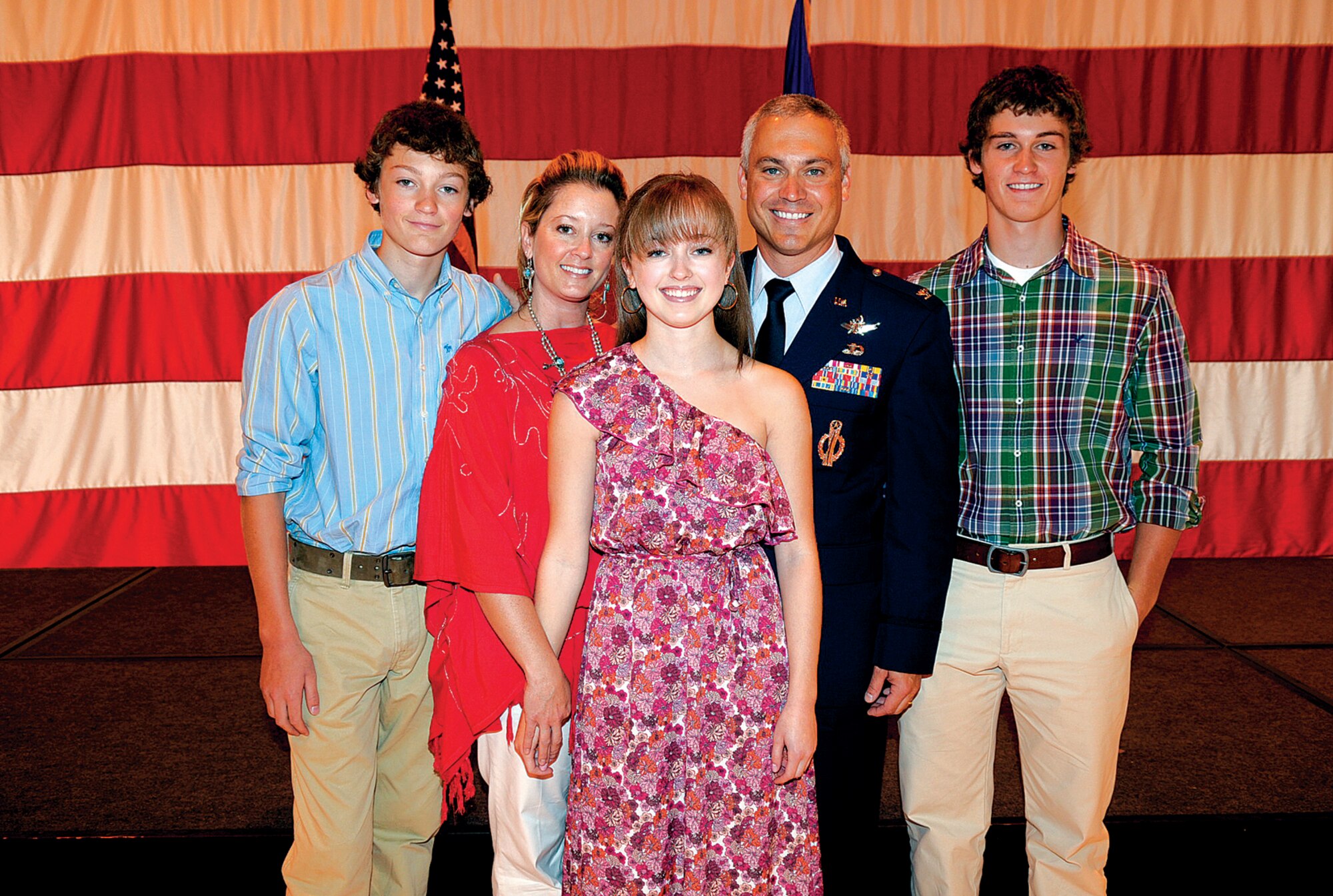 Col. Robert Vercher, 90th Operations Group commander, poses with his wife Amy, sons Chandler and Davis, and his daughter Alexis, for a quick family photo after the change-of-command ceremony July 8. The ceremony was held in Bldg. 1250. (U.S. Air Force photo by Gerald Teano)