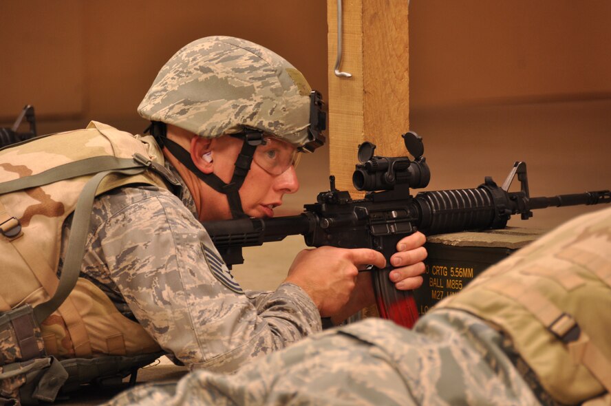 Tech. Sgt. Travis Payne, a 419th Fighter Wing Security Forces member waits for the signal from the combat arms instructors before firing his weapon. (U.S. Air Force photo/ Staff Sgt. Heather Skinkle)