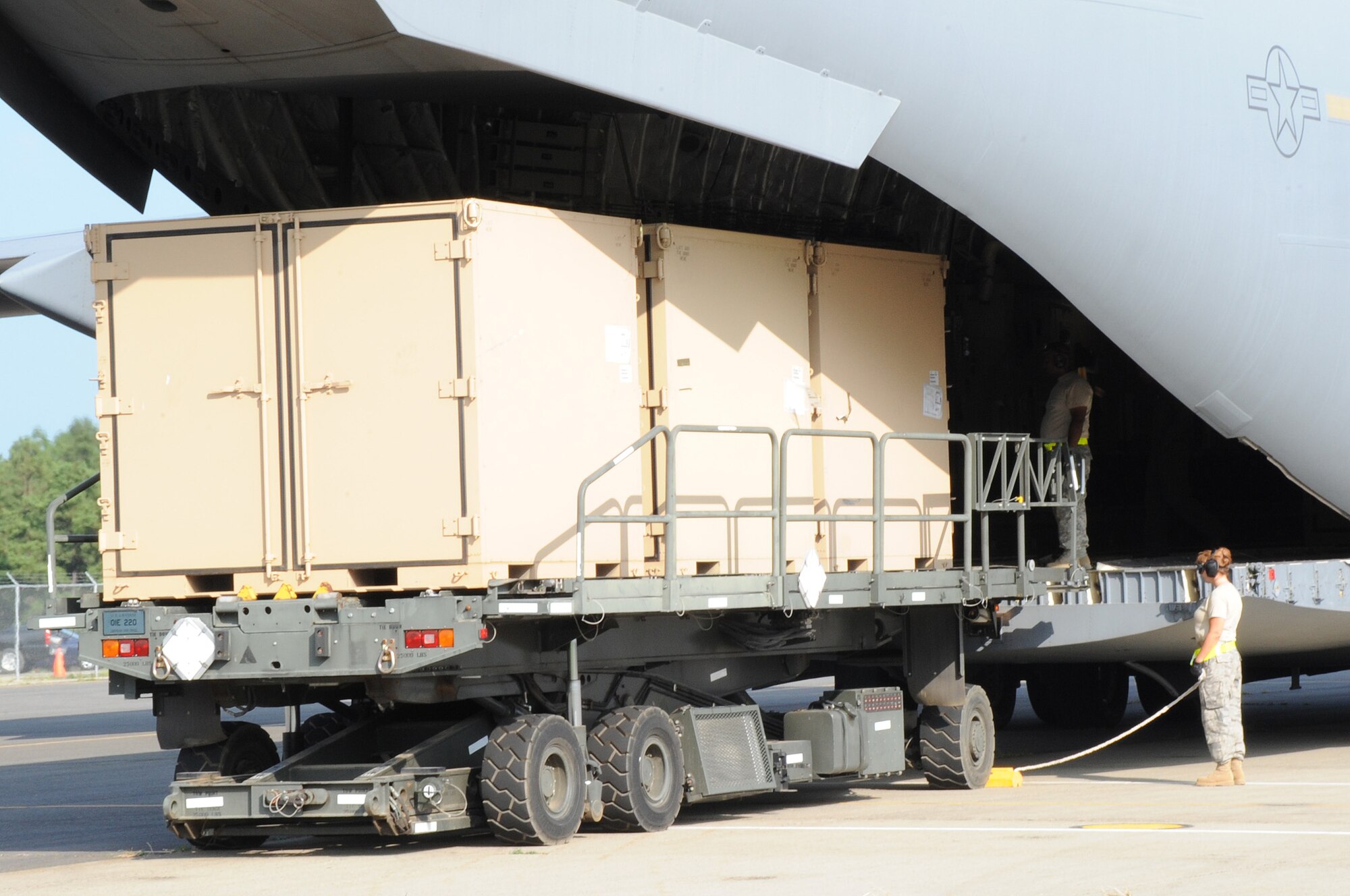 Members of the 108th Contingency Response Group work to unload relief supplies that were flown into the make-shift base to support New Jersey’s humanitarian mission during the Eagle Flag exercise Aug. 5 at Joint Base McGuire-Dix-Lakehurst. Hundreds of civilian responders and government officials participated in the exercise for the first time to test the region’s ability to respond to a major hurricane in the state. (U.S. Air Force photo/Airman 1st Class Bryan Swink)