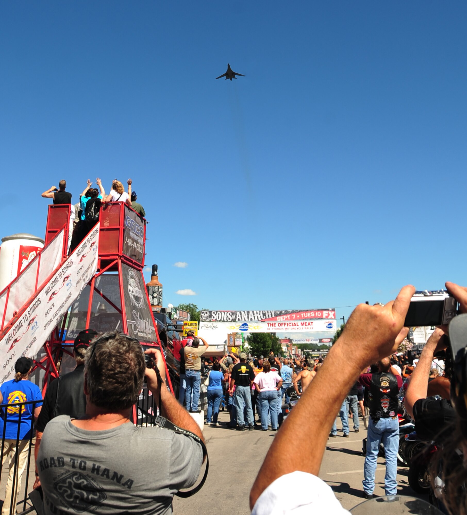 ELLSWORTH AIR FORCE BASE, S.D. -- Hundreds of on-lookers watch as a B-1B Lancer flies over main street on Military Appreciation Day during the Sturgis Motorcycle Rally, Aug. 10.  More than 500 bikers rode 57 miles from Ellsworth Air Force Base to Sturgis S.D. (U.S. Air Force photo/Airman 1st Class Anthony Sanchelli)