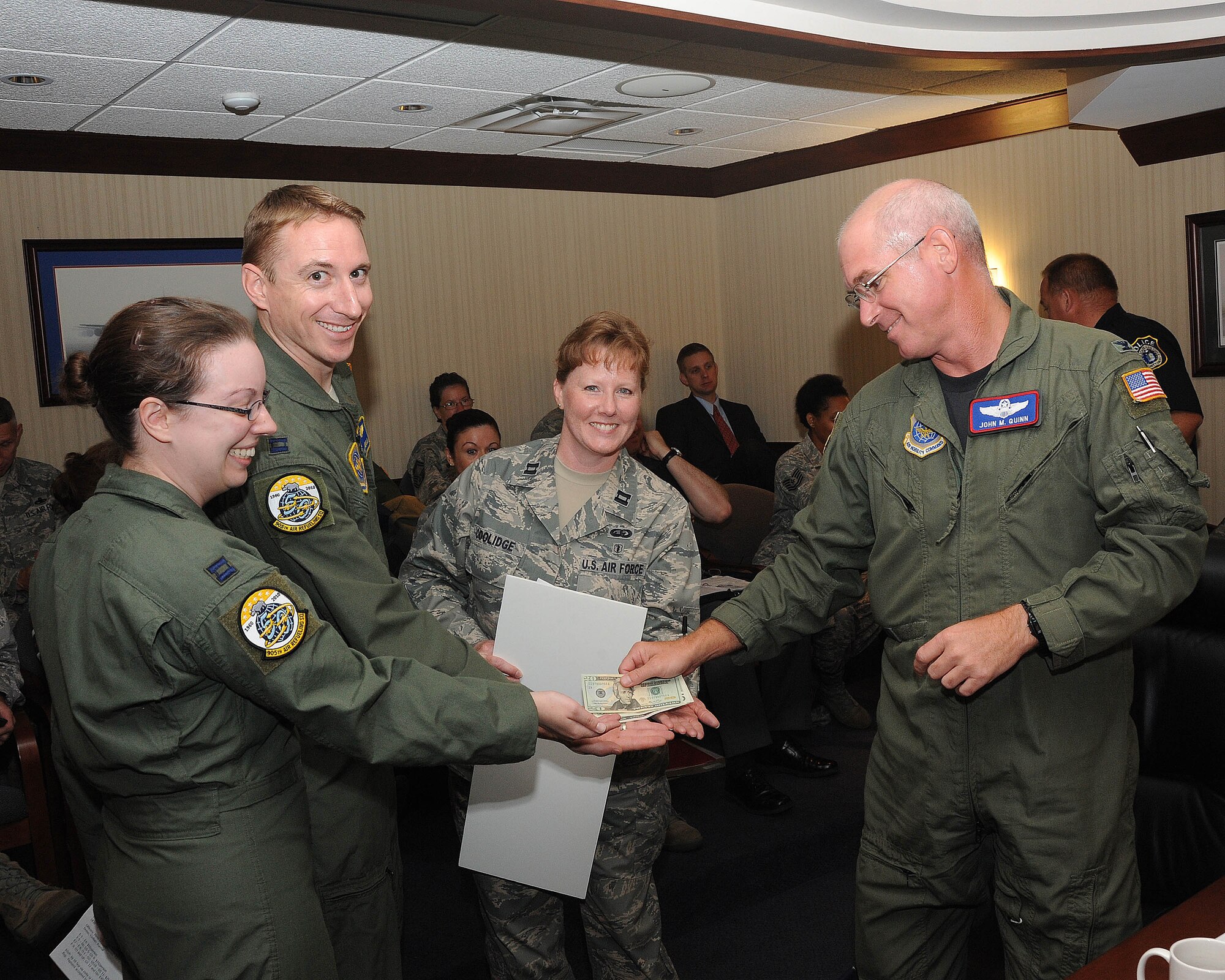 Col. John Quinn, 319th Air Refueling Wing vice-commander, buys the first ticket to the Grand Forks Air Force Base Air Force Ball Aug. 11. The ball will take place Sept. 17 at the Ralph Engelstad Arena Foyer. Tickets are on-sale now and can be bought through Company Grade Officers Association group representatives: Capt. Brent Chisholm, 319th ARW, 1st Lt. Ulises Atilano, 319th Medical Group, 1st Lt. Jonathan Barnes, 319th Mission Support Group, 2nd Lt. James Williams, 319th Maintenance Group and 2nd Lt. Anna Hall, 319th Operations Group.

Ticket prices vary per person depending on pay-grade; E-1 to E-4 cost $10, E-5 to E-6 and GS-5 to GS-9 cost $15, E-7 to E-8, O-1 to O-2 and GS-11 to GS-12 cost $25 and E-9, O-3 and up and GS-12 and up cost $30.