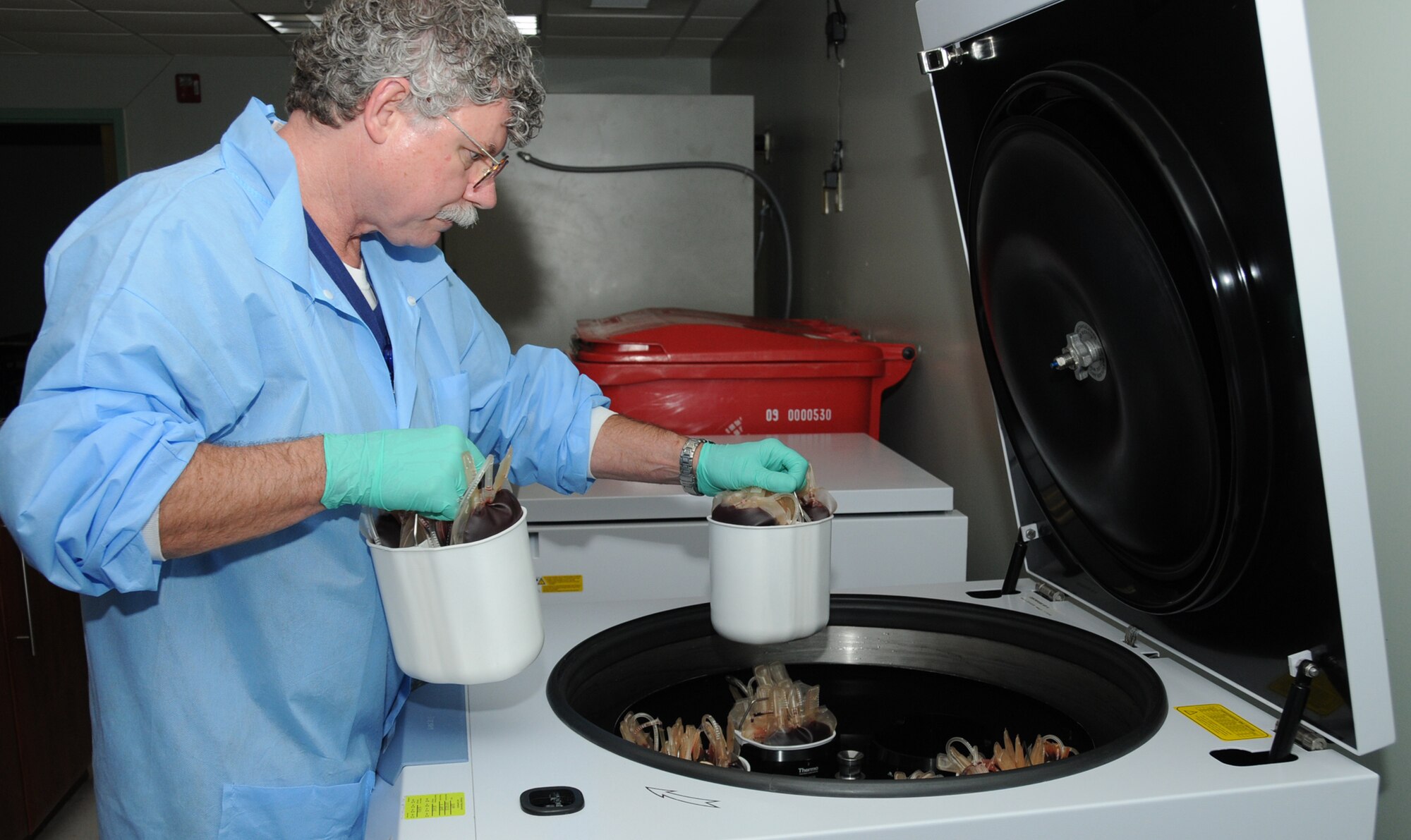 Lab technician Bill Meyer, 81 MDTS, prepares blood for separation in the centrifuge at the blood donor center.  The blood is separated into its three main components — red blood cells, plasma and platelets.  (U.S. Air Force photo by Kemberly Groue)