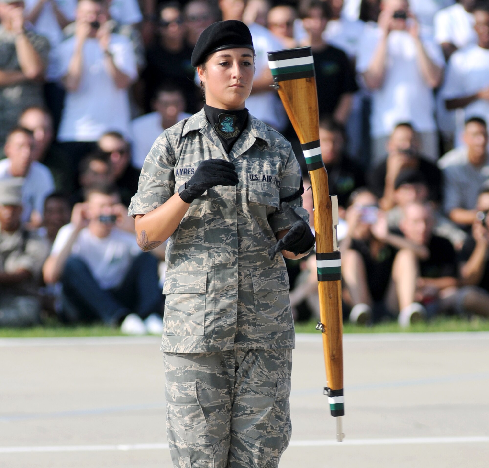 Airman 1st Class Katlyn Ayres, freestyle drill master for the 334th Training Squadron, twirls a rifle during Friday’s 81st Training Group drill down competition.  The Gators claimed first place in all three categories — freestyle drill, open ranks and regulation drill — to win the overall title for the third time this season.  (U.S. Air Force photo by Kemberly Groue)