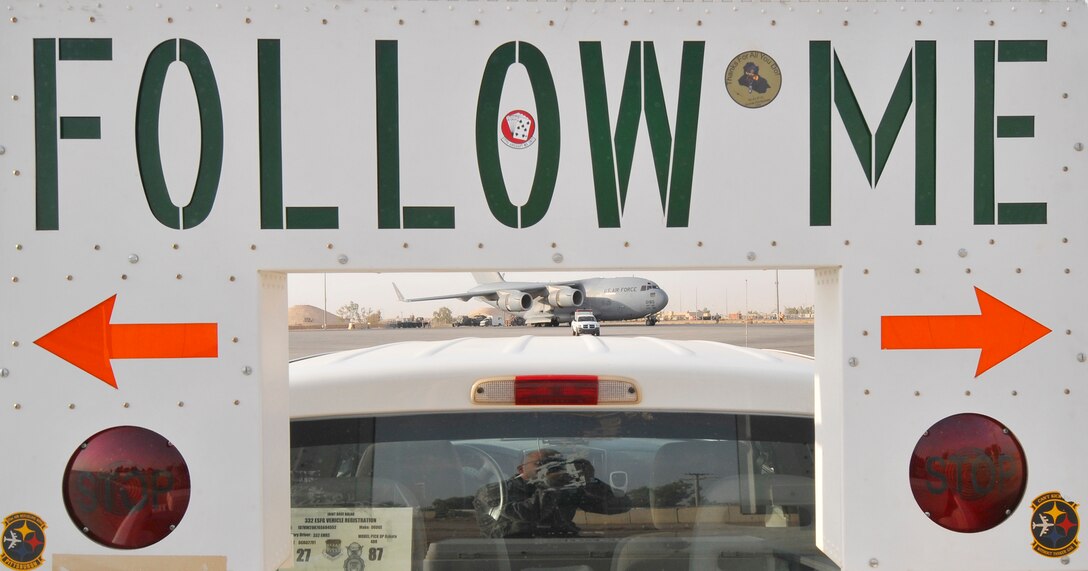 The Airmen of the 332nd Expeditionary Maintenance Squadron's transient alert shop use specialized vehicles to escort large aircraft on the flightline July 3, 2010, at Joint Base Balad, Iraq. TA members assist approximately 500 military and civilian aircraft per month that carry approximately 20,000 passengers, 4,000 tons of cargo and four tons of mail. (U.S. Air Force photo/Staff Sgt. Phillip Butterfield)