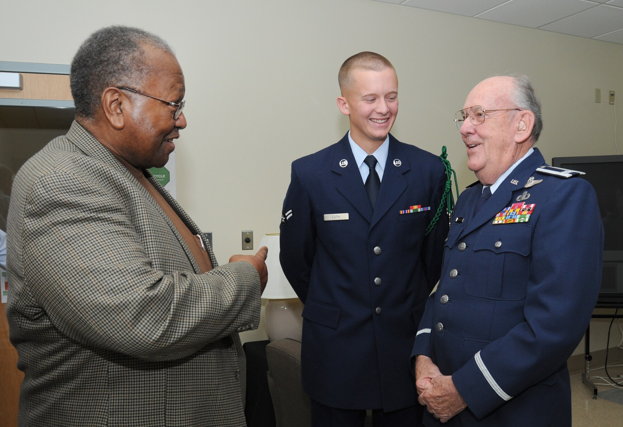 Retired Chief Master Sgt. Chris Moore, left, a former air traffic controller, talks with retired Col. Derrel Dempsey as the colonel’s grandson, Airman 1st Class Kiefer Luth, 334th TRS, listens and learns.   (U.S. Air Force photo by Kemberly Groue)
