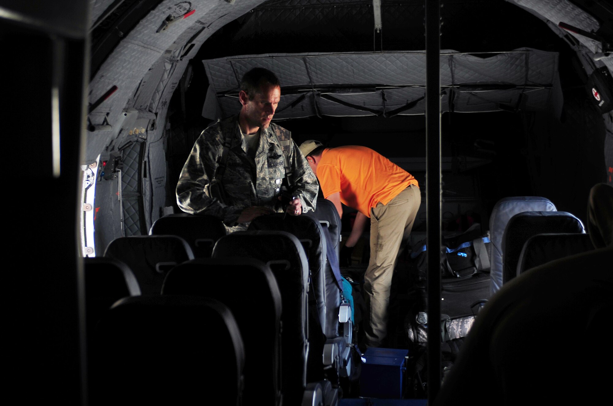 100812-N-6031Q-001 KABUL, Afghanistan - Col. Ken Madura, Commanding Officer, 438th Air Expeditionary Advisory Group, examines the inside of the sixth C-27 Spartan transport fixed wing aircraft that arrived at the Afghan Air Force base in Kabul, Afghanistan on Aug. 12, 2010. The new C-27 is the first in the new fleet to be outfitted as a VIP transport with the intended use of the aircraft to deliver high ranking government officials, including the president, around the country and its neighbors.(US Navy photo by Mass Communication Specialist 2nd Class David Quillen/ RELEASED).