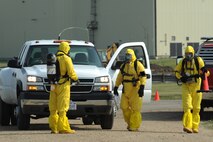 MINOT AIR FORCE BASE, N.D. -- 5th Civil Engineer Squadron explosive ordnance disposal members respond to an accident during a major accident response exercise here Aug. 5. The MARE simulated a broken arrow event where multiple base agencies were tested on response time and capabilities. (U.S. Air Force photo by Airman 1st Class Aaron-Forrest Wainwright)