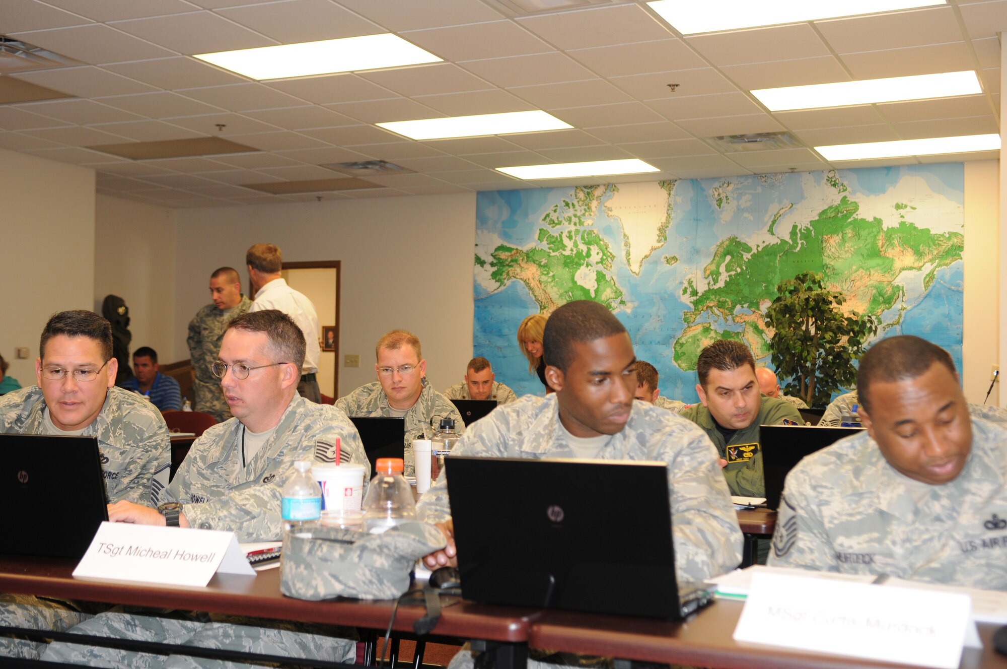 MOODY AIR FORCE BASE, Ga. -- Instructors help students during the Integrated Defense Risk Management Process and ForcePRO workshop here July 30. Students worked together in teams to answer and complete classroom exercises in designated time periods.