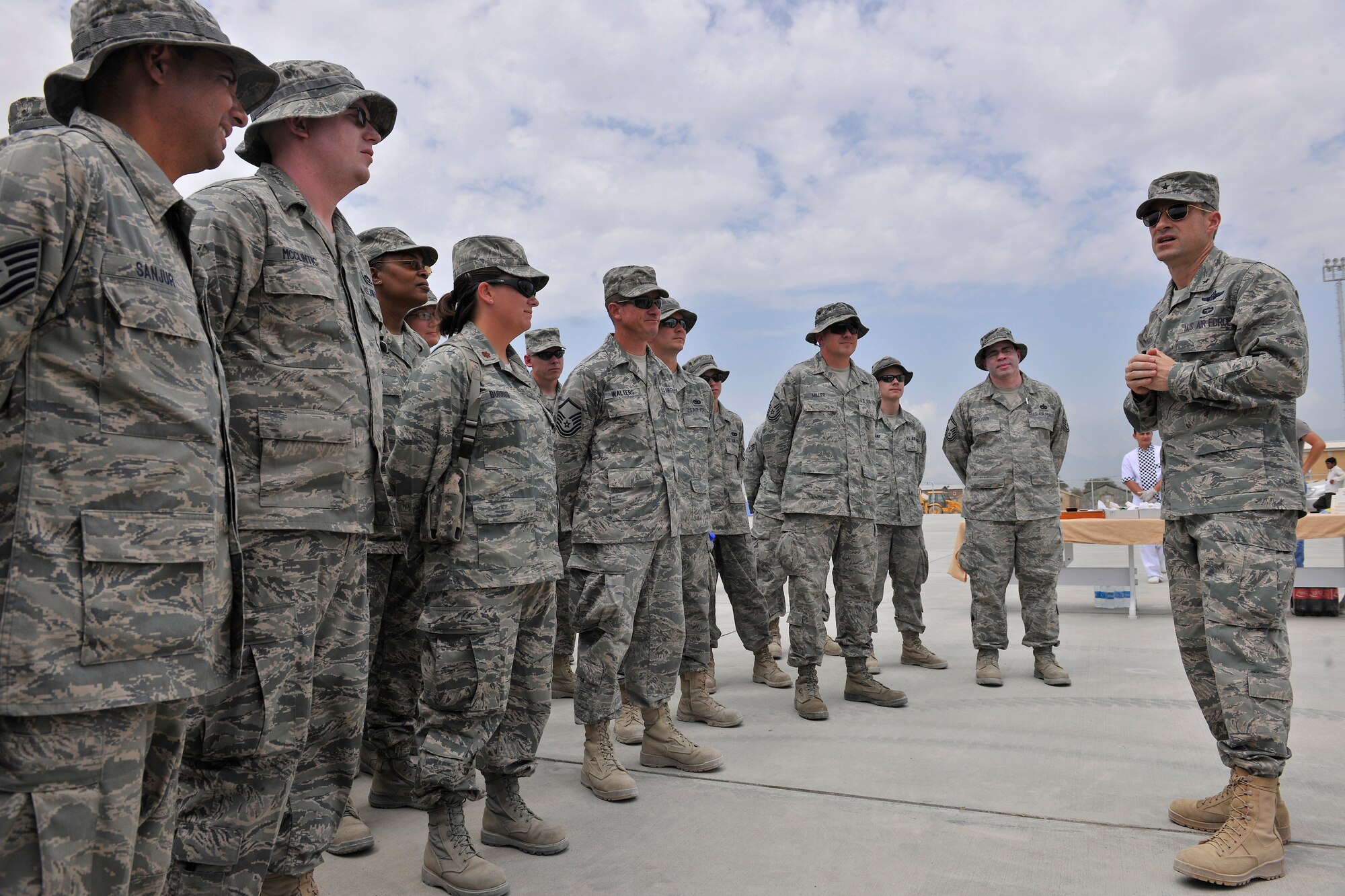 Brig. Gen. Jack Briggs, commander of the 455th Air Expeditionary Wing, speaks to aerial port Airmen, contractors and senior leaders during the new cargo handling ramp grand opening ceremony Aug. 11, 2010, Bagram Airfield, Afghanistan. The 90,000 square foot cargo handling ramp will improve cargo storage and distribution to base units and forward operating bases. (U.S. Air Force photo/Staff Sgt. Christopher Boitz)