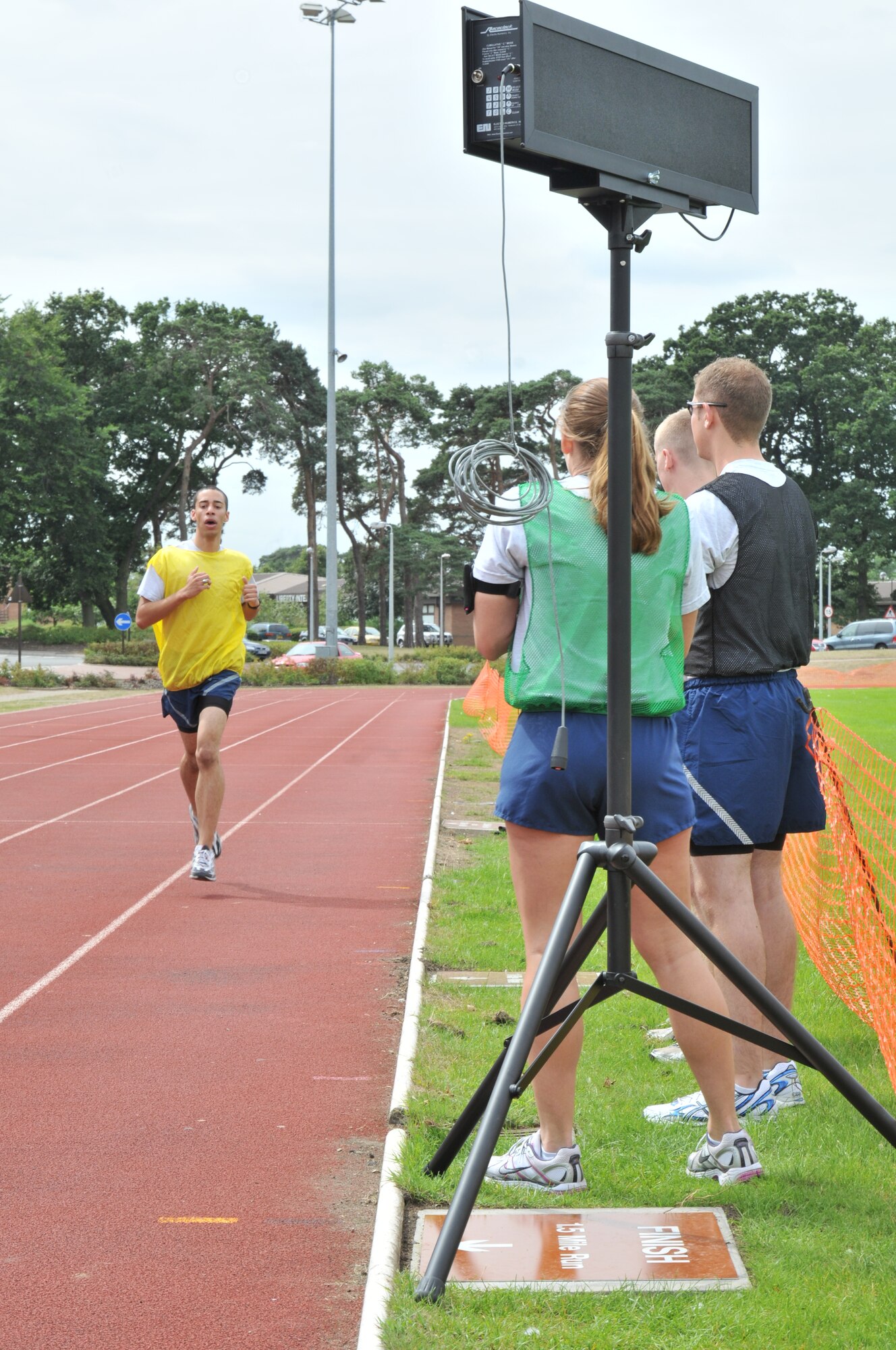 Airman 1st Class Aaron Medina of the 48th Medical Group runs 1.5 miles during the Commander’s Trophy PT Challenge August 6. After completing six laps on the track, Airman Medina tagged his next teammate to complete the challenge. (U.S. Air Force photo/Senior Airman David Dobrydney)