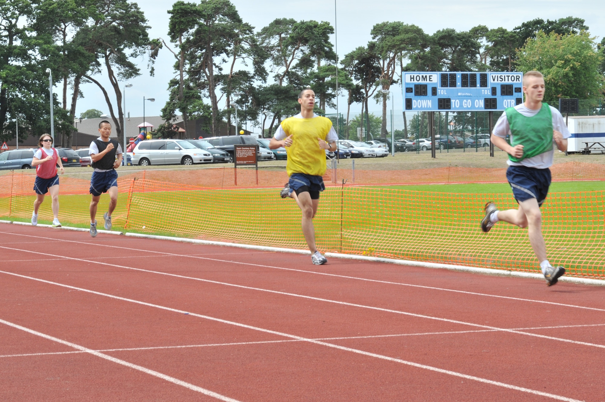 Airmen run 1.5 miles in the Commander’s Trophy PT Challenge at the RAF Lakenheath running track August 6. The Commander’s Trophy is a program meant to build sportsmanship and espirit de corps among units. (U.S. Air Force photo/Senior Airman David Dobrydney)