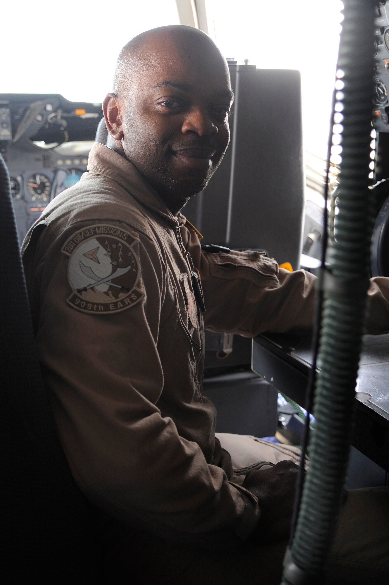 Tech. Sgt. Nathan Livingston, 908th Expeditionary Air Refueling Squadron flight engineer, poses for a photo in a KC-10 Extender Aug. 10 at an undisclosed location in Southwest Asia. Sergeant Livingston surpassed 5000 career flight hours Aug. 1.  Most of the hours were accumulated as a KC-10 fight engineer; however Sergeant Livingston has also accumulated combat hours in the C-5 Galaxy. (U.S. Air Force photo/Tech. Sgt. April Wickes) 