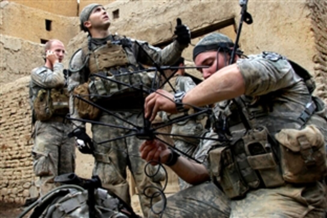 U.S. Army soldiers set up a tactical satellite communication system in Shekhabad Valley, Wardak province, Afghanistan, Aug. 9, 2010. The soldiers are assigned to the 173rd Airborne Brigade Combat Team.