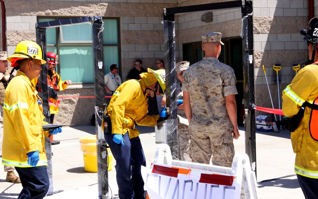 A Marine walks through a radiation detector during Camp Pendleton’s 2010 Vector West training exercise at the Paige Field house, Aug. 12. Vector West is an annual exercise where personnel conduct and evaluate their readiness for an emergency incident.  This year’s scenario involved an incident at the San Onofre Nuclear Generating Station. The base’s fire and emergency services enacted their emergency plan for a reception and decontamination center at Paige Field house, Naval Hospital Camp Pendleton, and the 21 Area Fitness Center.