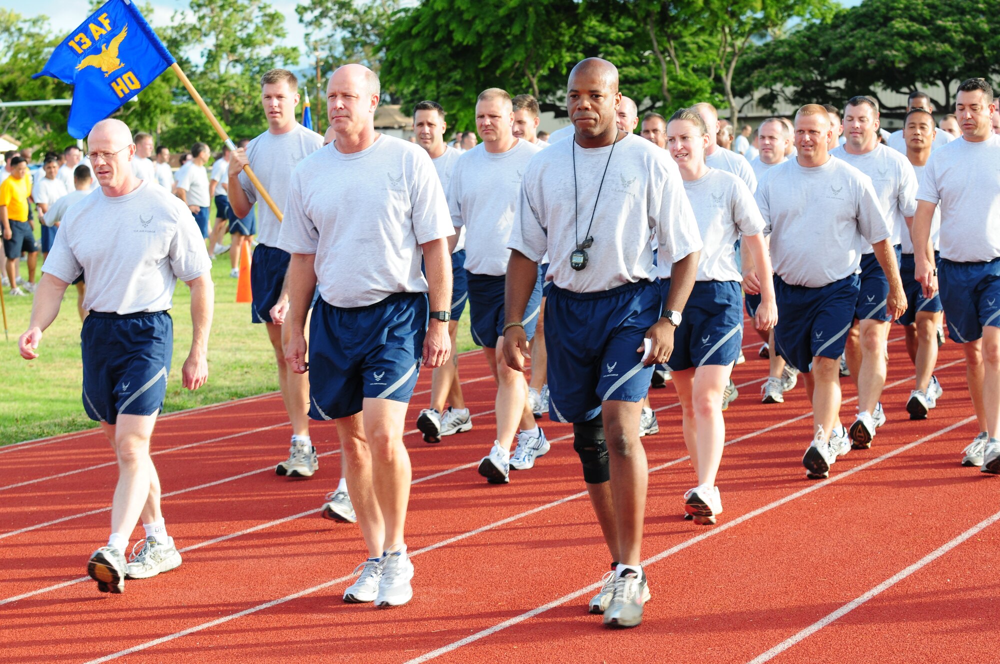 Brig. Gen. Thomas Harwood III, mobilization assistant to the commander, 13th Air Force, leads a warrior formation run as part of Jungle Day on Aug. 13, 2010. Thirteenth Air Force has observed Jungle Day in Hawaii since 2007, a tradition that originated when the organization was assigned to Andersen Air Force Base, Guam, because it gives members a chance to have fun and give back to the local community every Friday the 13th. (U.S. Air Force photos/ Tech. Sgt. Kerry Jackson) 
 
