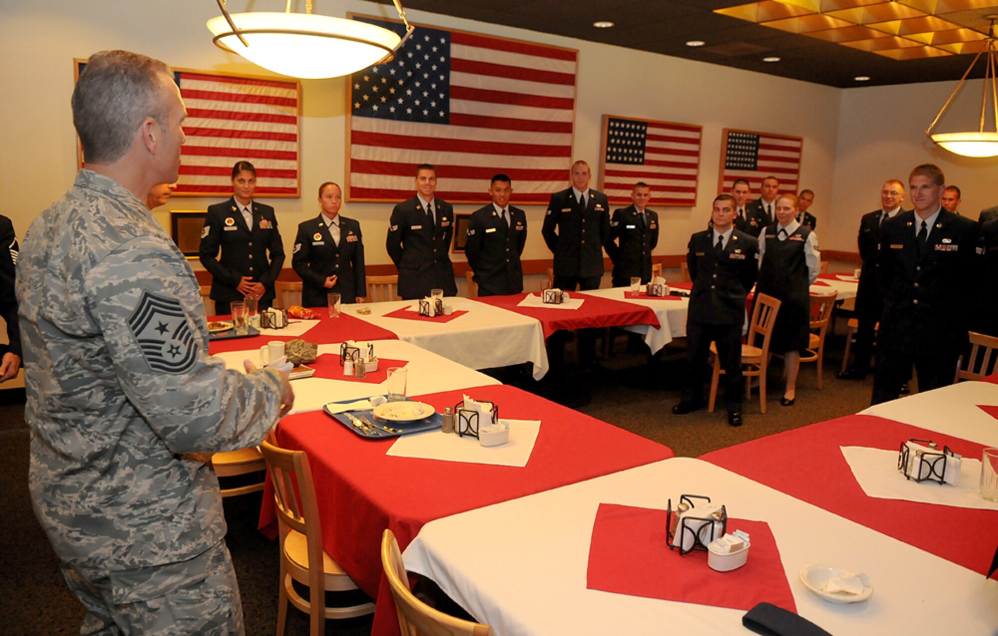 Chief Master Sgt. Martin Klukas, Air Combat Command command chief, says farewell to the Beale Airmen Leadship School class Aug. 6 at the Contrails Inn dining facility. During his visit Chief Klukas learned about the mission at Beale and was able to speak with Airmen across base. (U.S. Air Force photo by Airman 1st Class David Tracy)