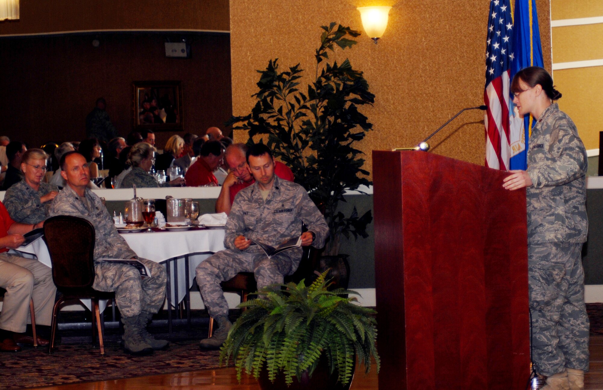 Maj. Jennifer Varga, 14th Comptroller Squadron commander, briefs members of the BLAZE Team and Base Community Council on the fiscal year 2009 economic impact of Columbus AFB on the local area, Aug. 6 at the Columbus Club. Columbus AFB generated $287 million in economic impact according to the report released Aug. 6. (U.S. Air Force Photo/Melissa Duncan). 
