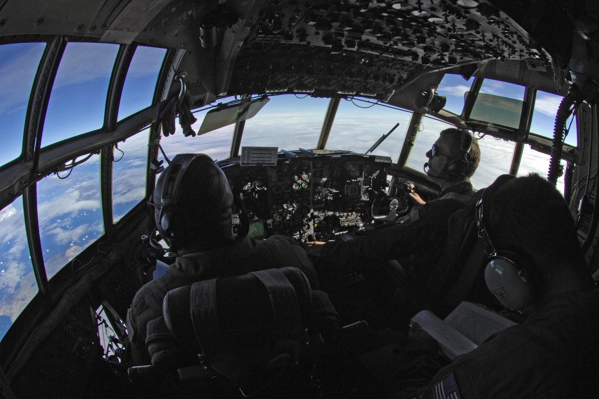 Maj. Leroy Kinlocke (left) and his co-pilot, Lt. Col. George Alston, have a front-row view of the diverse landscape July 28, 2010, in Greenland. The pilots are with the New York National Guard's 109th Airlift Wing, based out of Scotia, N.Y. (Department of Defense photo/Fred W. Baker III)
