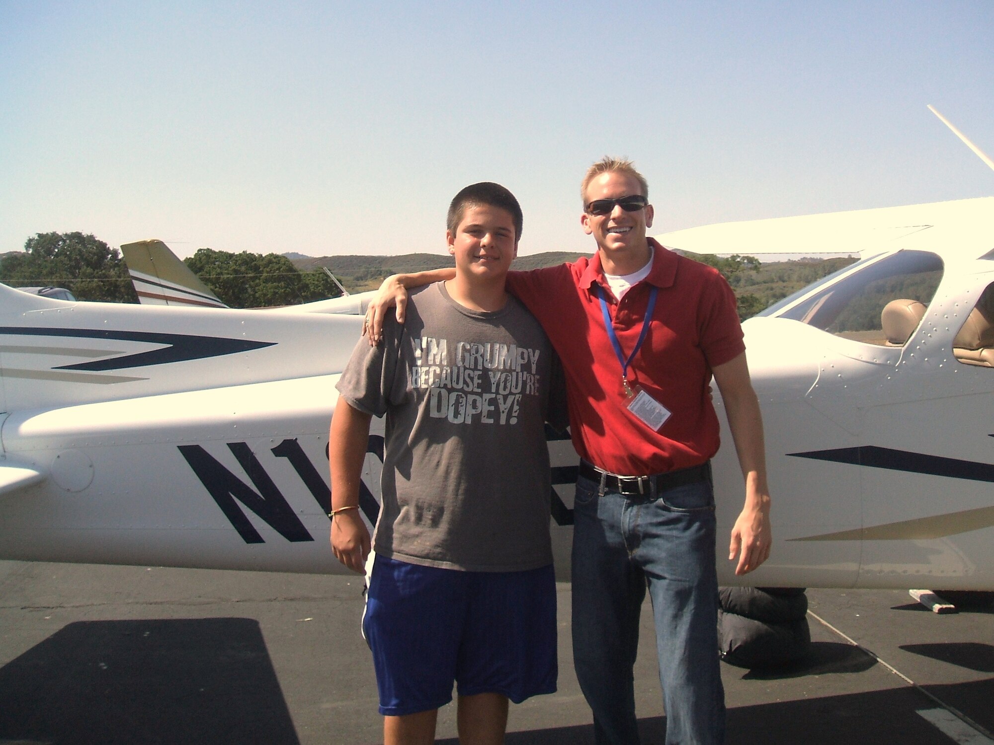 Paul Padilla, left, stands next to his pilot, Tim Taylor.  Mr. Taylor flew out of Edwards and picked up 14-year-old Paul at Mariposa-Yosemite Airport in Northern California. Paul was attending a camp for the deaf and Mr. Taylor, who is a command pilot for Angel Flight West, volunteered to pick him up and bring him back to his home in Hesperia, Calif.  Mr. Taylor is a flight instructor at Edwards Aero Club and is also an Air Force Reserve captain assigned to the 412th Operations Support Squadron.  (Courtesy photo) 