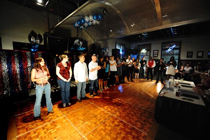 Participants wait as judges make the decision on the winners for Air Mobility Command ICON at Joint Base Charleston, S.C., Aug. 11, 2010. The command finals will include representatives from AMC?s 12 major installations and the top AMC affiliate unit participant. Each major installation within AMC will conduct their base-level AMC Icon contest during the months of July or August 2010. (U.S. Air Force photo/James M. Bowman)
