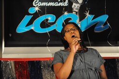 Airman 1st Class Joy Clayton wins first place after singing Natural Woman by Aretha Franklin during Air Mobility Command ICON at Joint Base Charleston, S.C., Aug.11, 2010. AMC Icon is based loosely around the TV show, American Idol. AMC Icon is designed to showcase the vocal talents of the AMC communities. The top rated AMC active duty Air Force participant from each base will be that installations representative in the command finals. Airman Clayton won $500 and also received a Millie Lewis Scholarship which is for an eight week Advanced Professional course designed for those who wish to continue their personal development, as well as becoming involved and skilled in the exciting world of commercial print and/or fashion modeling. Airman Clayton is a member of the 16th Airlift Squadron. (U.S. Air Force photo/James M. Bowman)