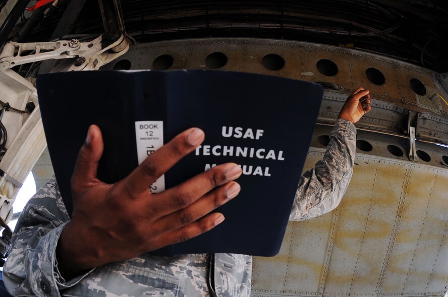 BARKSDALE AIR FORCE BASE, La. - Staff Sgt. Courtney Hawkins, 2d Maintenance Squadron crew chief, uses an Air Force technical order manual to ensure every step of maintenance is done correctly during a pre-flight maintenance inspection. The crew chiefs will be a component of the Global Strike Challenge competition. (U.S. Air Force photo/Senior Airman Brittany Y. Bateman)(RELEASED)
