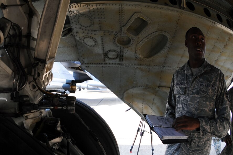 BARKSDALE AIR FORCE BASE, La. -- Staff Sgt. Courtney Hawkins, 2d Maintenance Squadron crew chief, performs pre-flight checks Aug. 13 in preparation of the Global Strike Challenge. The crew chiefs have been preparing for numerous hours each day in order to excel during the competition. (U.S. Air Force photo/Senior Airman Brittany Y. Bateman)(RELEASED) 