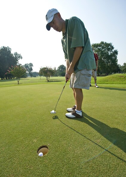 BARKSDALE AIR FORCE BASE, La. -- Maj. Matt Calhoun sinks a putt during a golf tournament Aug. 13. The golf tournament was one of many events held to celebrate the one year anniversary of Air Force Global Strike Command. (U.S. Air Force photo by Senior Airman Chad Warren)(RELEASED)