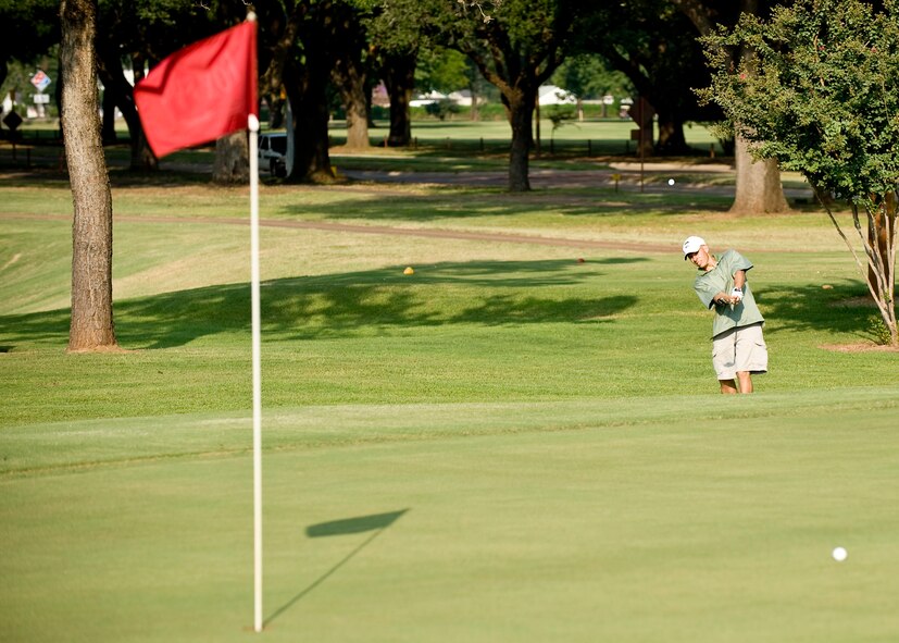 BARKSDALE AIR FORCE BASE, La. -- Maj. Matt Calhoun chips his ball onto the green during a golf tournament Aug. 13. The golf tournament was one of many events held to celebrate the one year anniversary of Air Force Global Strike Command. (U.S. Air Force photo by Senior Airman Chad Warren)(RELEASED)