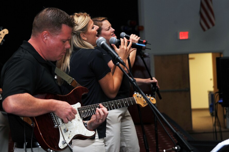 BARKSDALE AIR FORCE BASE, La. -- Members of the Air Force Band of the West "Top Flight" perform during the celebration of the first year anniversary of the Air Force Global Strike Command at Hoban Hall Aug. 13. The USAF Band of the West has a long lineage in the United States Air Force. The band was created Oct. 1, 1941, at Moffett Field, Calif. (U.S. Air Force photo by Senior Airman Brittany Y. Bateman)(RELEASED)