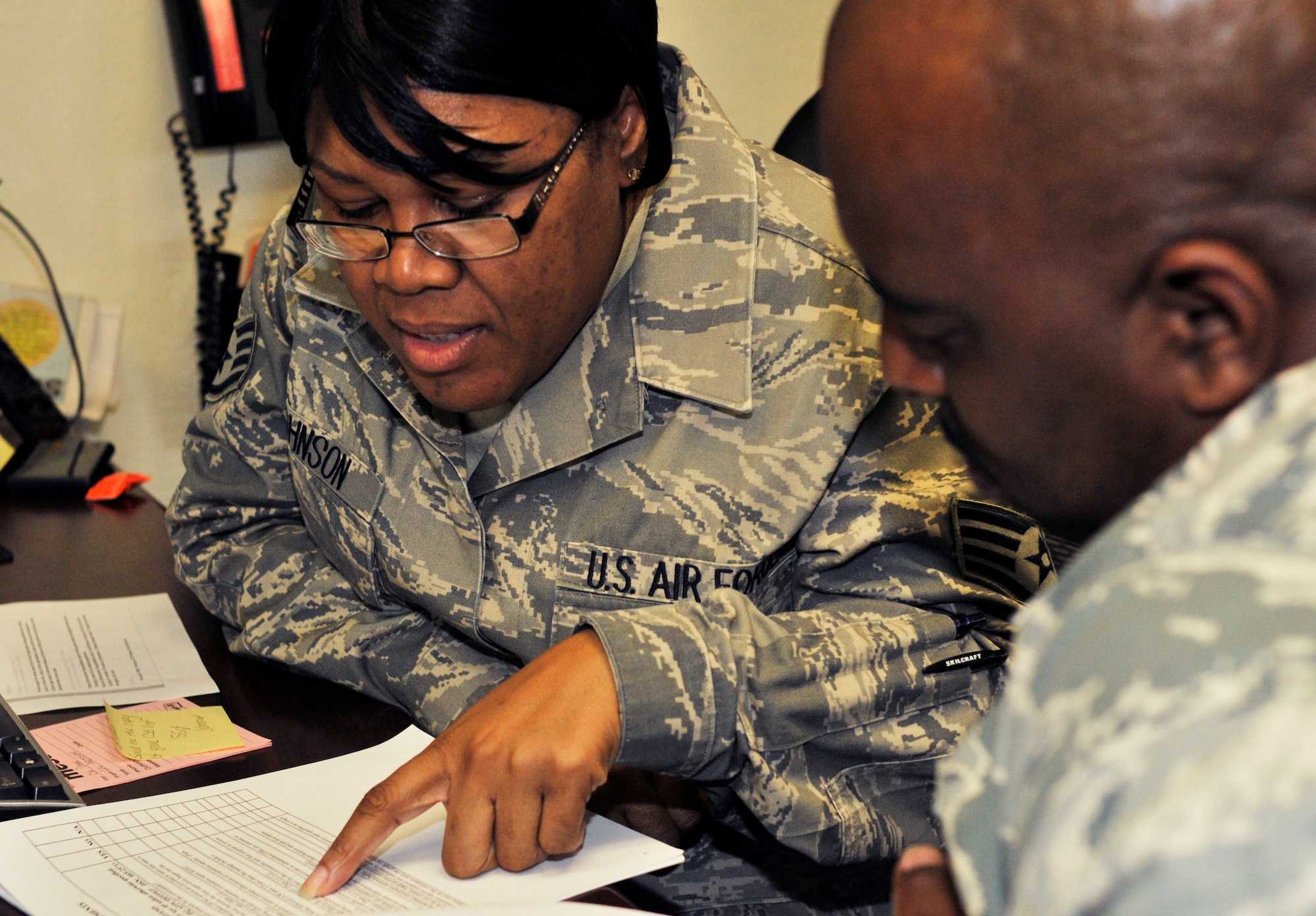 PATRICK AIR FORCE BASE,Fla -- Staff Sgt. Lakeasha Johnson,personnelist, 920th Mission Support Squadron here, demonstrates superior customer service as Air Force Reservists at the 920th Rescue Wing here inquire about their military careers. Known as Citizen Airmen, Air Force Reservists are dedicated, dual-hatted professionals who live in your neighborhood and work in your community. When called to duty, reservists put their civilian lives on hold to defend our nation. (U.S. Air Force photo/Senior Airman Terrance Hanley) 