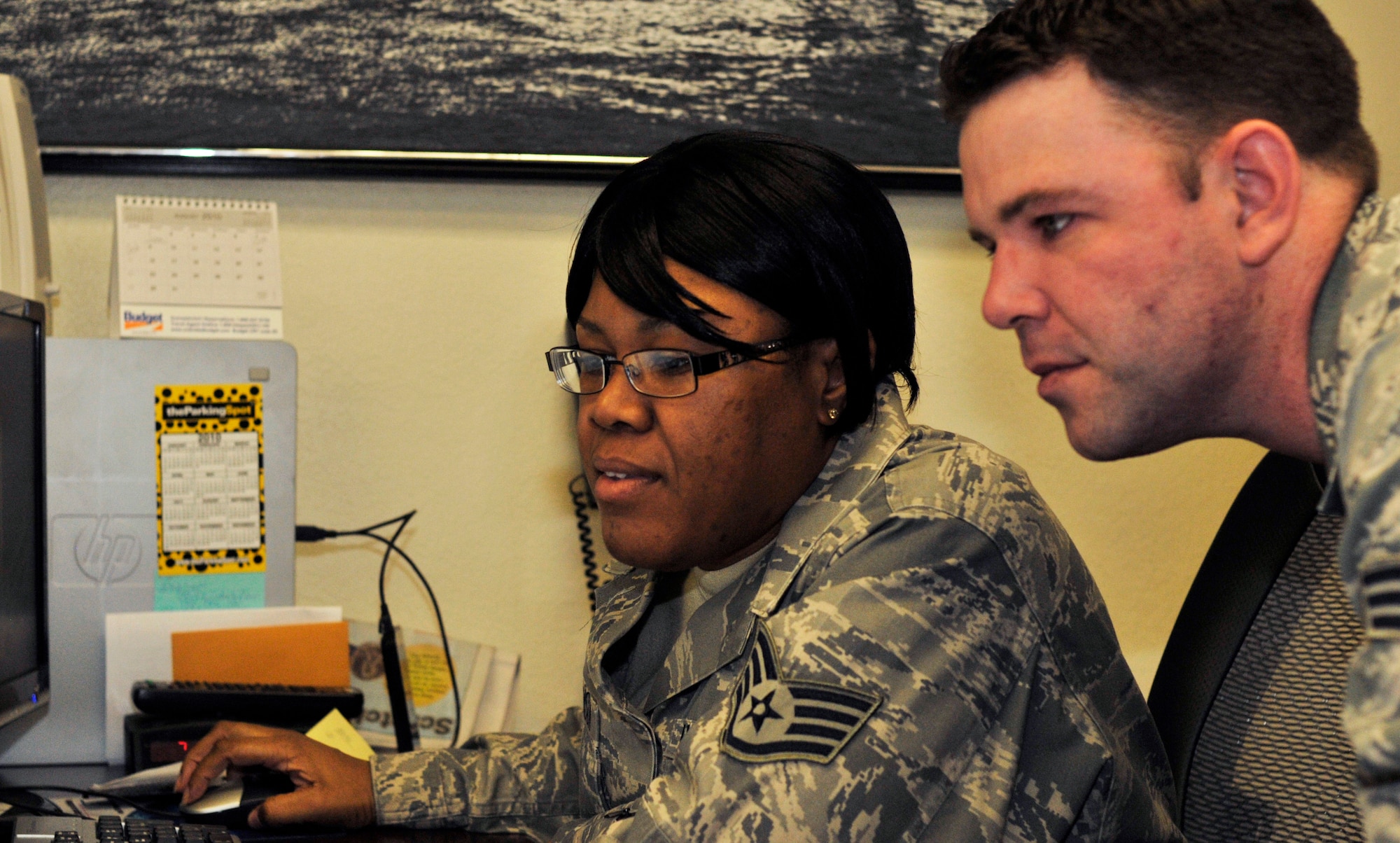 PATRICK AIR FORCE BASE,Fla -- Staff Sgt. Lakeasha Johnson,personnelist, 920th Mission Support Squadron here, demonstrates superior customer service as Air Force Reservists at the 920th Rescue Wing here inquire about their military careers. Known as Citizen Airmen, Air Force Reservists are dedicated, dual-hatted professionals who live in your neighborhood and work in your community. When called to duty, reservists put their civilian lives on hold to defend our nation. (U.S. Air Force photo/Senior Airman Terrance Hanley) 