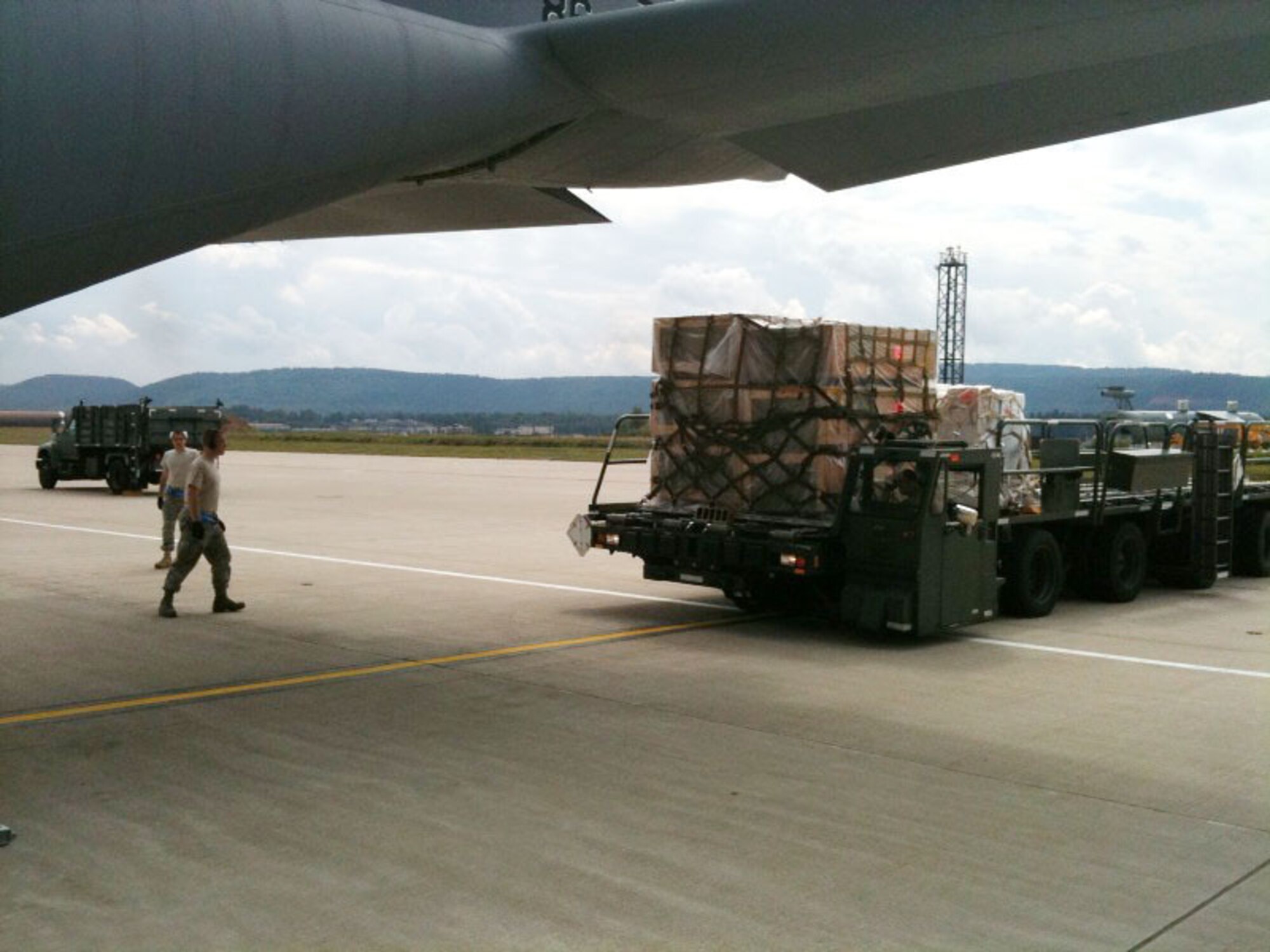 RAMSTEIN AIR BASE, Germany -- Air Force personnel load firefighting equipment onto a C-130J, bound for Russia, here Aug 13, 2010. The equipment is part of a joint U.S. Air Forces Europe, U.S. Naval Forces Europe/Africa, Marine Forces Europe and U.S. Army Europe effort to assist the Russian government in fighting the wildfires in the country. (U.S. Air Force photo by Master Sgt. Keith Houin)