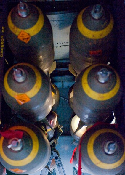 BARKSDALE AIR FORCE BASE, La. -- Capt. Christopher Zummo, 96th Bomb Squadron B-52 radar navigator, inspects M117 bombs inside the bomb bay of a B-52 before takeoff Aug. 11. The flight was part of an exercise leading up to Air Force Global Strike Command first ever Global Strike Challenge. (U.S. Air Force photo by Senior Airman Chad Warren)(RELEASED)