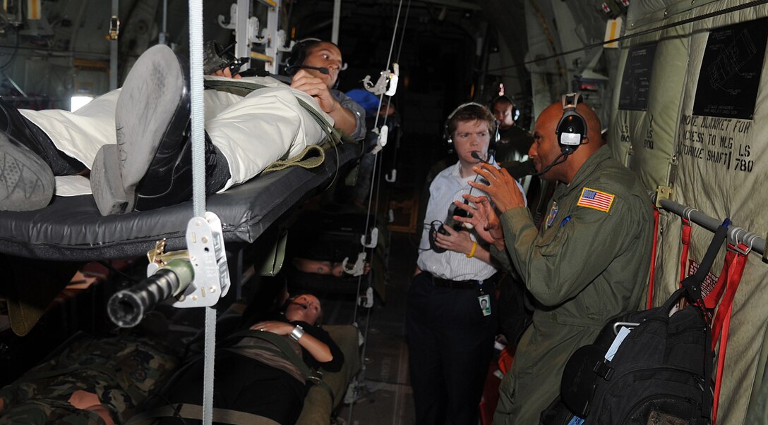 Senior Master Sgt. Rodney Lindsey, 375th Aeromedical Evacuation Squadron superintendent, explains medical evacuation procedures to members of the congressional delegation while they lay in litters used for real patients about a C-130J, 12 August 2010. 16 members of the congressional delegation flew from Joint Base Andrews, Md. to Scott Air Force Base, Il. to tour Headquarters Air Mobility Command and meet with General Raymond E. Johns Jr., Commander HQ AMC. (U.S. Air Force photo by Senior Airman Melissa V. Brownstein)