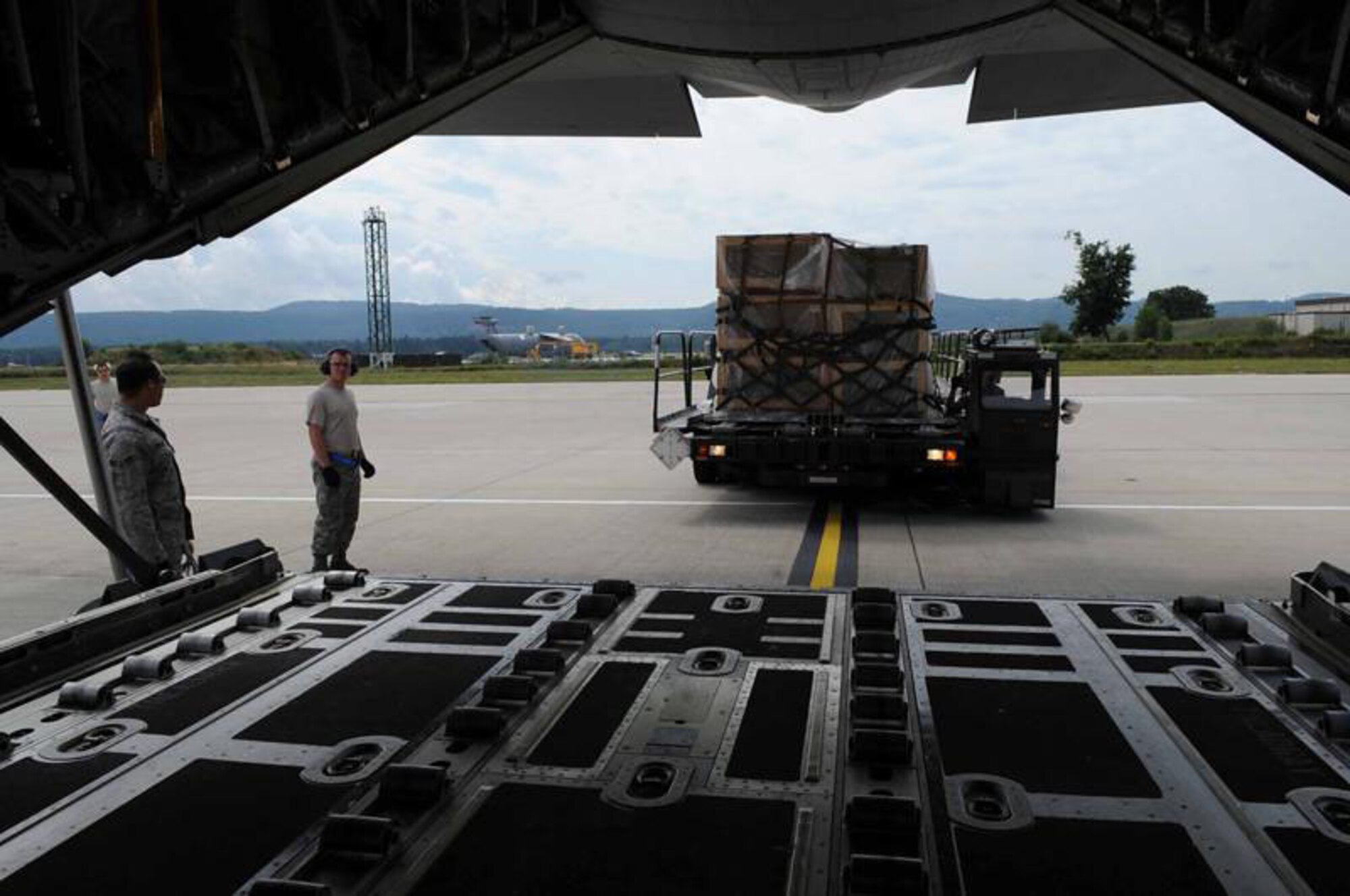 RAMSTEIN AIR BASE, Germany -- Air Force personnel load firefighting equipment onto a C-130J, bound for Russia, at Ramstein Air Base Aug. 13, 2010. The equipment is part of a joint U.S. Air Forces Europe, U.S. Naval Forces Europe/Africa, Marine Forces Europe and U.S. Army Europe effort to assist the Russian government in fighting the wildfires in the country. (U.S. Army photo by Staff Sgt. Lawree Washington)