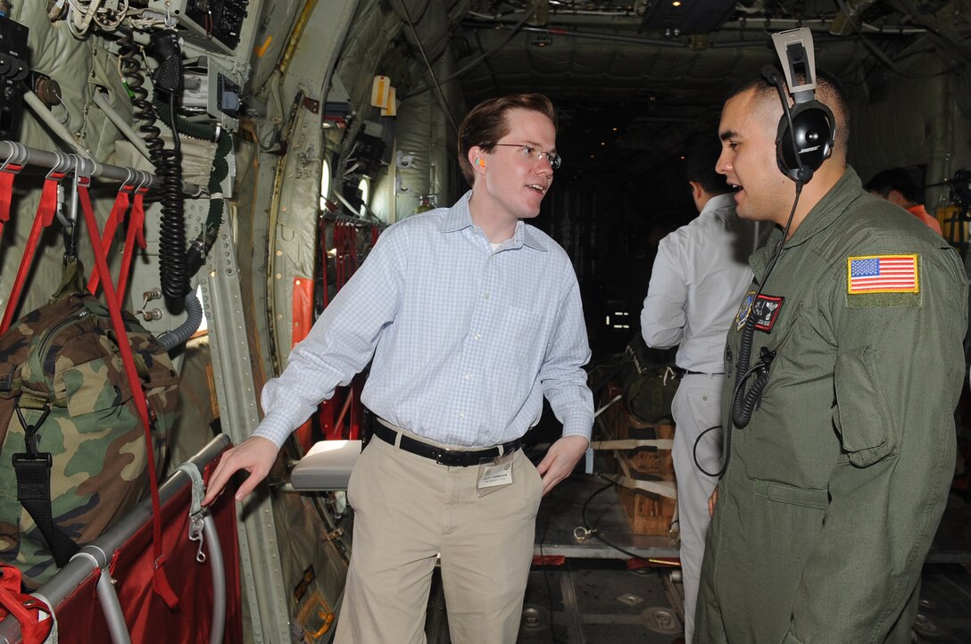 Technical Sgt. Josh Romero, 41st Airlift Squadron load master, talks to Scott Cunningham, congressional delegate for Congressman Kenny Marchant from the 24th of Texas, about the capabilities of a C-130J, 12 August 2010. The C-130J is primarily used for transport and aerial refueling and is an updated version of the C-130 Hercules. (U.S. Air Force photo by Senior Airman Melissa V. Brownstein)