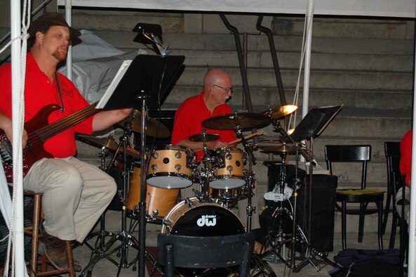 From left, Tom Breece, the head of the music department at Motlow State Community College, and AEDC’s Joe Reavis, as members of the South Jackson Band, play for an ice cream social at the South Jackson Civic Center in the summer of 2007. Reavis is among the “community of drummers” who also play at the Friday Night Jam sessions held every month at the Arnold Lakeside Center. (Photo by Maureen Burke)