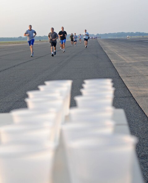 BARKSDALE AIR FORCE BASE, La. -- Members from Air Force Global Strike Command are almost at the 1-mile mark during the 5K Fun Run Aug. 13 on the flightline. The Fun Run was the first event of many for the first-year anniversary of the stand-up of AFGSC. Other events included a golf tournament, dodge-ball, bowling and basketball. An award ceremony at Hoban Hall followed the events. (U.S. Air Force photo by Senior Airman Alexandra M. Boutte) (RELEASED)