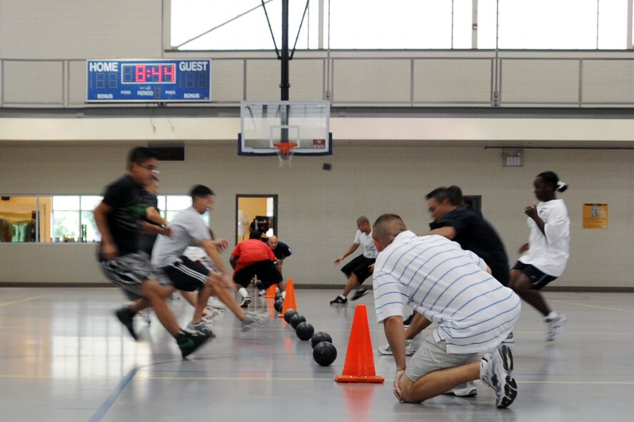 BARKSDALE AIR FORCE BASE, La. -- Airmen from Air Force Global Strike Command participates in a game of dodge ball at the fitness center Aug. 13. Dodge ball was just one event during the celebration of the first year anniversary of the stand up of AFGSC. (U.S. Air Force photo by Senior Airman Brittany Y. Bateman)(RELEASED) 